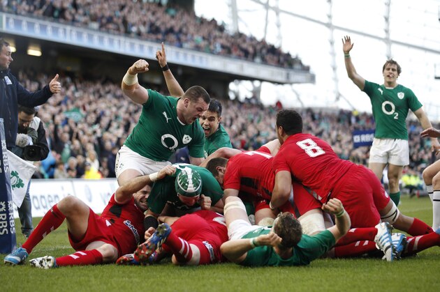 Ireland's Cian Healy, centre left, reacts after Chris Henry scored a try against Wales during their Six Nations Rugby Union international match at the Aviva Stadium, Dublin, Ireland, Saturday, Feb. 8, 2014.  (AP Photo/Peter Morrison)