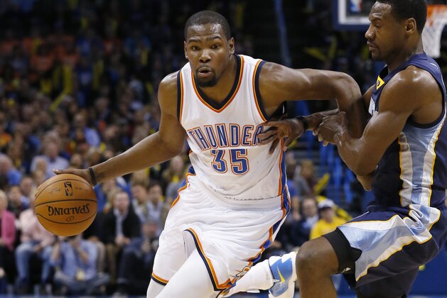 Oklahoma City Thunder forward Kevin Durant (35) drives around Memphis Grizzlies forward Tony Allen during the third quarter of an NBA basketball game in Oklahoma City, Wednesday, Feb. 11, 2015. Oklahoma City won 105-89. (AP Photo/Sue Ogrocki)