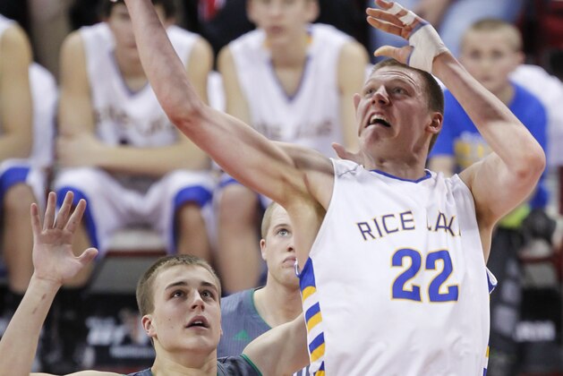 Rice Lake's Henry Ellenson (22) shoots against Greendale's Tommy Kujawa during the first half of their Division 2 semifinals in the WIAA boys' state basketball championships Friday, March 20, 2015, in Madison, Wis. (AP Photo/Andy Manis)