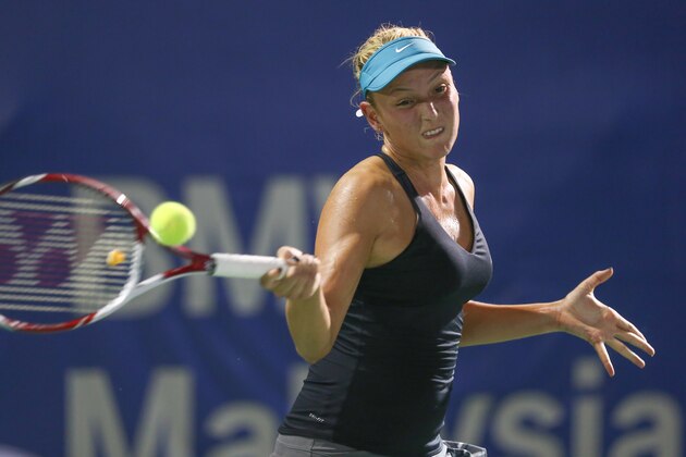 Donna Vekic from Croatia return a shot against Karolina Pliskova from Czech Republic  during the Women Single's semi final match of the WTA BMW Malaysian Open 2014 in Kuala Lumpur, Malaysia, Saturday, April 19, 2014. (AP Photo/Vincent Thian)