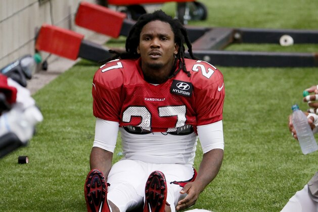 Arizona Cardinals running back Chris Johnson (27) stretches during NFL football training camp, Tuesday, Aug. 18, 2015, in Glendale, Ariz. (AP Photo/Matt York)