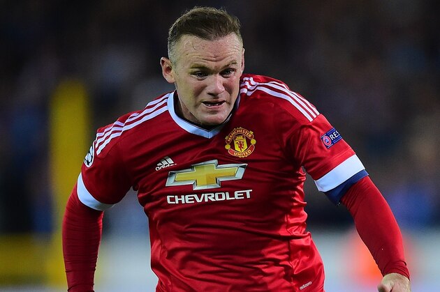 Manchester United's Wayne Rooney (R) controls the ball next to Club Brugge's Claudemir during the UEFA Champions League playoff football match between Club Brugge and Manchester United at Jan Breydel Stadium in Bruges, August 26, 2015. AFP PHOTO / EMMANUEL DUNAND (Photo credit should read EMMANUEL DUNAND/AFP/Getty Images) Manchester United's Wayne Rooney (R) controls the ball next to Club Brugge's Claudemir during the UEFA Champions League playoff football match between Club Brugge and Manchester United at Jan Breydel Stadium in Bruges, August 26, 2015. AFP PHOTO / EMMANUEL DUNAND (Photo credit should read EMMANUEL DUNAND/AFP/Getty Images)