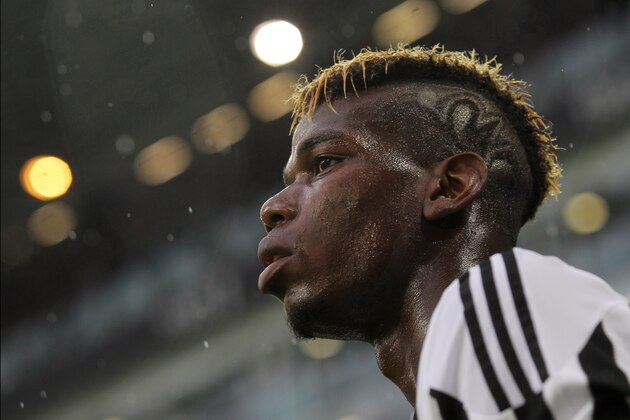 Juventus' midfielder from France, Paul Pogba looks on during the Italian Serie A football match Juventus Vs Udinese on August 23, 2015 at the 'Juventus Stadium' in Turin.  AFP PHOTO / MARCO BERTORELLO        (Photo credit should read MARCO BERTORELLO/AFP/Getty Images)