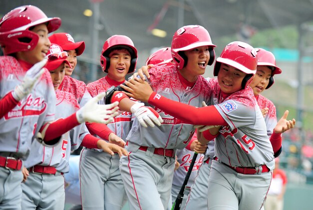 Aug 26, 2015; Williamsport, PA, USA; Japan first baseman Shingo Tomita (10) celebrates with teammates after hitting a home run in the third inning against Latin America at Howard J. Lamade Stadium. Mandatory Credit: Evan Habeeb-USA TODAY Sports