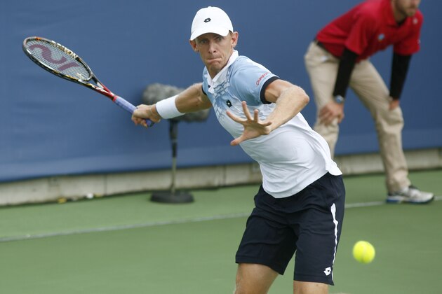 Kevin Anderson, of South Africa, returns to Jack Sock, of the United States, at the Western & Southern Open tennis tournament, Wednesday, Aug. 19, 2015, in Mason, Ohio. (AP Photo/David Kohl)