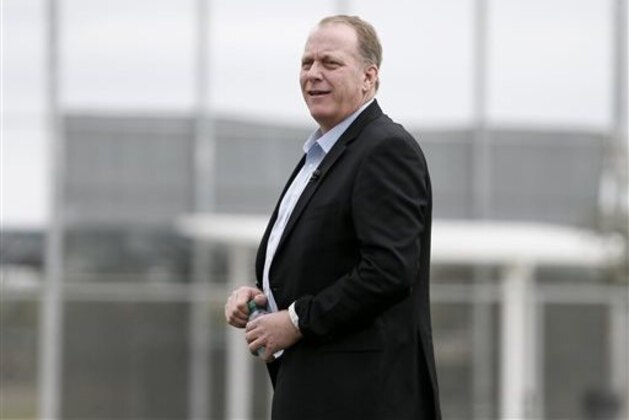 FILE- In this Feb. 25, 2015, file photo, baseball broadcast analyst and former Boston Red Sox pitcher Curt Schilling watches as the Red Sox workout at baseball spring training in Fort Myers Fla. Boston Mayor Martin J. Walsh wants to ban chewing tobacco in sports venues across the city. The mayor is expected to discuss a proposed new ordinance Wednesday, Aug. 5. Public health officials, advocates, local youth and Schilling are expected to attend. (AP Photo/Tony Gutierrez, File)