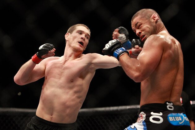 LAS VEGAS, NV - JANUARY 31:  Jordan Mein (L) connects on Thiago Alves in their welterweight bout during UFC 183 at the MGM Grand Garden Arena on January 31, 2015 in Las Vegas, Nevada. Alvez won with a second-round TKO victory. (Photo by Steve Marcus/Getty Images)