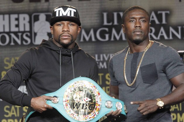 Floyd Mayweather Jr., left, and Andre Berto pose at a news conference in Los Angeles on Thursday, Aug. 6, 2015. Mayweather says Berto is a worthy opponent for the final fight of his perfect career. (AP Photo/Nick Ut)