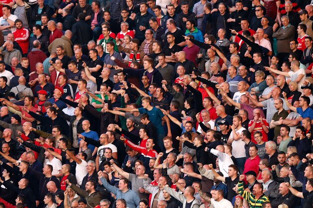 BRUGGE, BELGIUM - AUGUST 26: Manchester United fans cheer during the UEFA Champions League qualifying round play off 2nd leg match between Club Brugge and Manchester United held at Jan Breydel Stadium on August 26, 2015 in Brugge, Belgium.  (Photo by Dean Mouhtaropoulos/Getty Images)