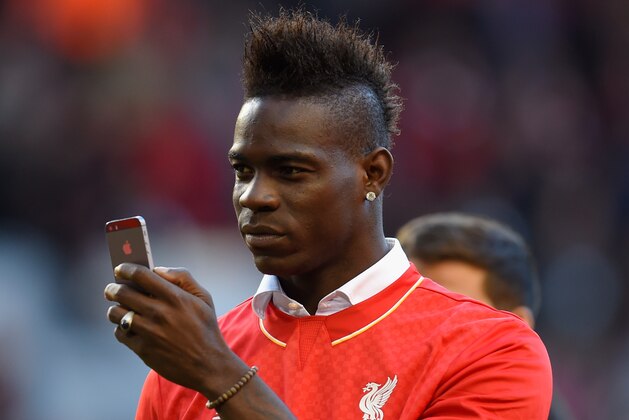 LIVERPOOL, ENGLAND - MAY 16:  Mario Balotelli of Liverpool takes pictures of the fans on his phone after the Barclays Premier League match betrween Liverpool and Crystal Palace at Anfield on May 16, 2015 in Liverpool, England.  (Photo by Stu Forster/Getty Images)