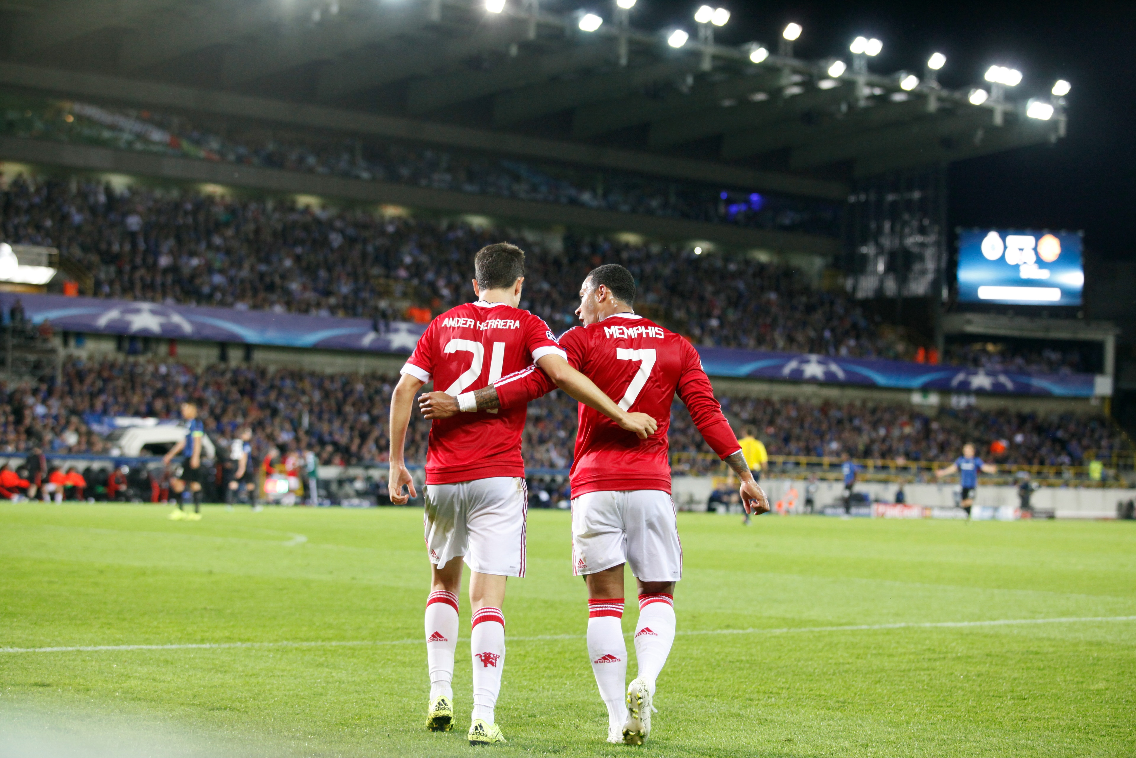 Manchester United’s Memphis Depay, right, and Ander Herrera walk on the pitch during the Champions League play-off round, second leg soccer match at  the Jan Breydel Stadium in Brugge, Belgium on Wednesday Aug. 26, 2015. (AP Photo/Francois Walschaerts)