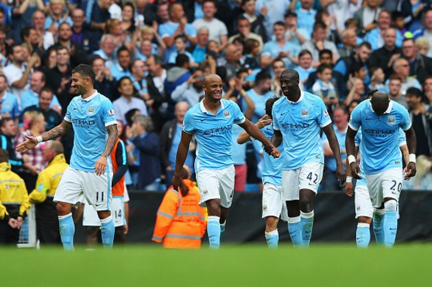 MANCHESTER, ENGLAND - AUGUST 16: Vincent Kompany of Manchester City celebrates scoring his team's second goal with Yaya Toure of Manchester City during the Barclays Premier League match between Manchester City and Chelsea at the Etihad Stadium on August 16, 2015 in Manchester, England.  (Photo by Alex Livesey/Getty Images)