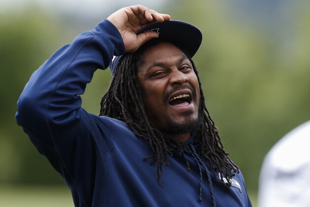 Seattle Seahawks running back Marshawn Lynch walks off the field following an NFL football minicamp Thursday, June 18, 2015, in Renton, Wash. (AP Photo/Joe Nicholson)