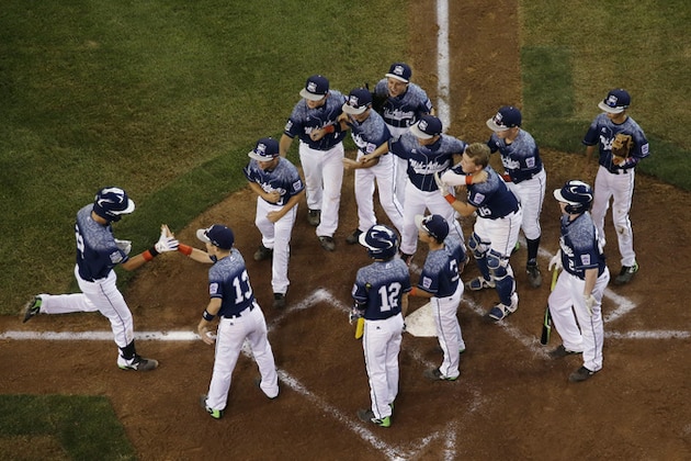 Lewisberry, Pa.'s Cole Wagner, left, celebrates with teammates after hitting a home run off Pearland, Texas' Jarrett Tadlock during the third inning of a U.S. double-elimination baseball game at the Little League World Series, Wednesday, Aug. 26, 2015, in South Williamsport, Pa. Lewisberry won 3-0. (AP Photo/Matt Slocum)