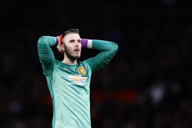Manchester United’s goalkeeper David De Gea looks up at the end of  the English FA Cup quarterfinal soccer match between Manchester United and Arsenal at Old Trafford Stadium, Manchester, England, Monday, March 9, 2015. Arsenal won the game 2-1.(AP Photo/Jon Super)