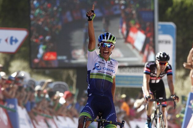 Orica GreenEdge Colombian cyclist Esteban Chaves Rubio celebrates as he crosses the finish line to win the second stage of the 2015 Vuelta Espana cycling tour, a 158.7km stage between Alhaurin de la Torre and Caminito del Rey.  AFP PHOTO/JOSE JORDAN        (Photo credit should read JOSE JORDAN/AFP/Getty Images)