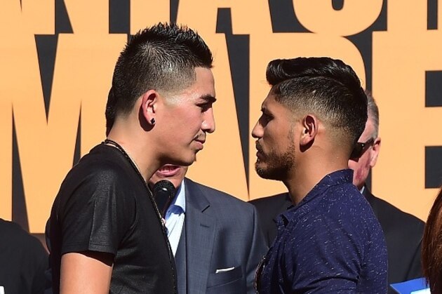 Undefeated two-Division World Champion Leo 'El Terremoto' Santa Cruz (L) and former three-division world champion Abner Mares (R)  face off at a press conference in Los Angeles on July 14, 2015, to announce their 12-round featherweight fight taking place on August 29 in Los Angeles. AFP PHOTO/ FREDERIC J. BROWN        (Photo credit should read FREDERIC J. BROWN/AFP/Getty Images)