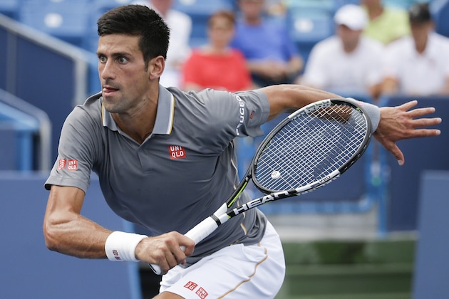 Novak Djokovic, of Serbia, runs to the ball during a match against Benoit Paire, of France, at the Western & Southern Open tennis tournament, Wednesday, Aug. 19, 2015, in Mason, Ohio. Djokovic won 7-5, 6-2. (AP Photo/John Minchillo)