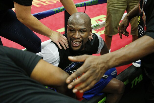 Floyd Mayweather Jr. finishes a work out at his gym Wednesday, Aug. 26, 2015, in Las Vegas. Mayweather is scheduled to fight Andre Berto in a welterweight title bout next month in Las Vegas. (AP Photo/John Locher)