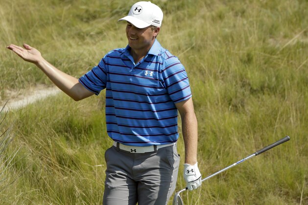 Jordan Spieth reacts after making his bunker shot on the 18th hole during the second round of the PGA Championship golf tournament Friday, Aug. 14, 2015, at Whistling Straits in Haven, Wis. (AP Photo/Chris Carlson)