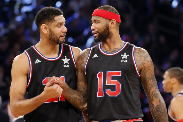 West Team’s Tim Duncan, left, of the San Antonio Spurs, and DeMarcus Cousins, of the Sacramento Kings, talk during the second half of the NBA All-Star basketball game, Sunday, Feb. 15, 2015, in New York. (AP Photo/Kathy Willens)