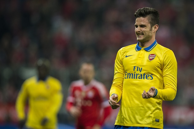 Arsenal's French striker Olivier Giroud reacts during the second-leg round of 16 UEFA Champions league football match between Bayern Munich and Arsenal at the Allianz arena in Munich on March 11, 2014.   AFP PHOTO / ODD ANDERSEN        (Photo credit should read ODD ANDERSEN/AFP/Getty Images)