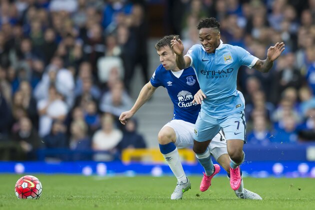 Everton's Seamus Coleman, left, fights for the ball against Manchester City's Raheem Sterling during the English Premier League soccer match between Everton and Manchester City at Goodison Park Stadium, Liverpool, England, Sunday, Aug. 23, 2015. (AP Photo/Jon Super)