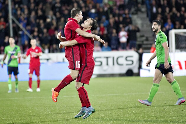 FC Midtjylland's Jesper Lauridsen and Erik Sviatchenko celebrates, after the Europa League playoff second leg soccer match between FC Midtjylland and Southampton FC in Herning, Denmark, Thursday, Aug. 27, 2015. (Astrid Dalum/Polfoto via AP) DENMARK OUT