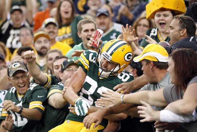 Green Bay Packers' Jeff Janis celebrates with fans after catching a touchdown pass during the first half of an NFL football preseason game against the Kansas City Chiefs Thursday, Aug. 28, 2014, in Green Bay, Wis. (AP Photo/Mike Roemer)