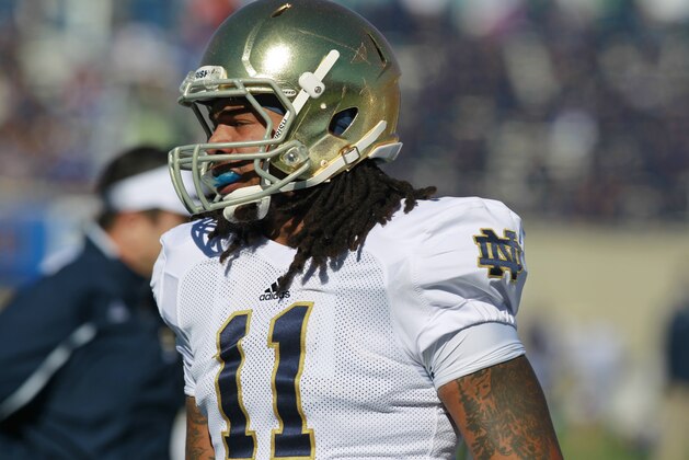 Notre Dame linebacker Ishaq Williams warms up before facing Air Force in the first second quarter of an NCAA football game at the Air Force Academy, Colo., on Saturday, Oct. 26, 2013. (AP Photo/David Zalubowski)