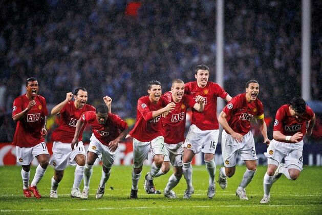 Manchester United players celebrate the moment they win the penalty shoot-out against Chelsea in the Champions League Final at the Luzhniki Stadium on May 21st 2008 in Moscow, Russia (Photo by Tom Jenkins/Getty Images). An image from the book 'In The Moment' published June 2012