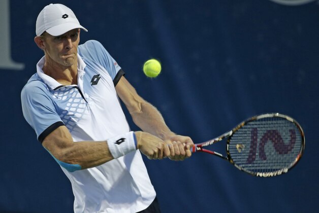 Kevin Anderson, of South Africa, returns a shot against Borna Coric, of Croatia, during a quarterfinal in the Winston-Salem Open tennis tournament in Winston-Salem, N.C., Thursday, Aug. 27, 2015. (AP Photo/Chuck Burton)