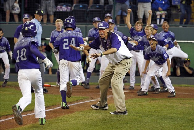 Pearland, Texas' Caleb Low (10) heads for home and a celebration after hitting a two-run home run off Bonita, Calif.'s Jacob Baptista during the eighth inning of a U.S. elimination baseball game at the Little League World Series in South Williamsport, Pa., Thursday, Aug. 27, 2015. Pearland won 9-7. (AP Photo/Gene J. Puskar)