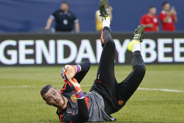 Manchester United goalkeeper David De Gea warms up before an International Champions Cup soccer match against Paris Saint-Germain on Wednesday, July 29, 2015, in Chicago. (AP Photo/Kamil Krzaczynski)