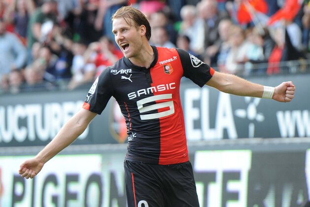 Rennes' Swedish forward Ola Toivonen celebrates after scoring a goal during the French L1 football match between Rennes and Guingamp on April 12, 2015 at the Route de Lorient stadium in Rennes, western France. AFP PHOTO / THOMAS BREGARDIS        (Photo credit should read THOMAS BREGARDIS/AFP/Getty Images)