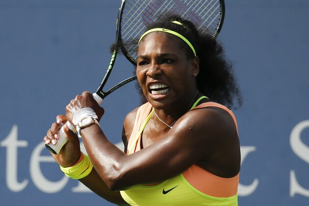Serena Williams returns the ball to Simona Halep, of Romania, during a final match at the Western & Southern Open tennis tournament, Sunday, Aug. 23, 2015, in Mason, Ohio. Williams defeated Halep 6-3, 7-6 (5). (AP Photo/John Minchillo)