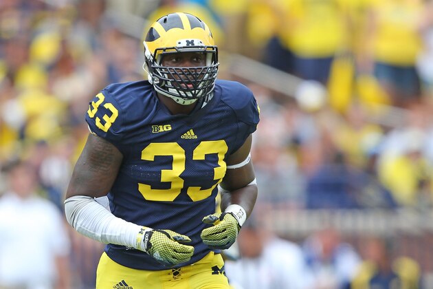 ANN ARBOR, MI - AUGUST 30: Taco Charlton #33 of the Michigan Wolverines looks to make the stop during the second half of the game against the Appalachian State Mountaineers on August 30, 2014 in Ann Arbor, Michigan. The Wolverines defeated the Mountaineers 52-14.  (Photo by Leon Halip/Getty Images)