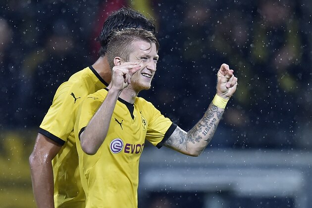 Dortmund's Marco Reus celebrates after scoring during the Europa League play-off 2nd leg soccer match between Borussia Dortmund and Odds BK in Dortmund, Germany, Thursday, Aug. 27, 2015. (AP Photo/Martin Meissner)