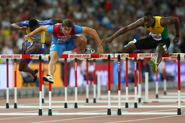 BEIJING, CHINA - AUGUST 27:  (L-R) Shane Brathwaite of Barbados, Sergey Shubenkov of Russia and Hansle Parchment of Jamaica compete in the Men's 110 metres hurdles semi-final during day six of the 15th IAAF World Athletics Championships Beijing 2015 at Beijing National Stadium on August 27, 2015 in Beijing, China.  (Photo by Alexander Hassenstein/Getty Images for IAAF)