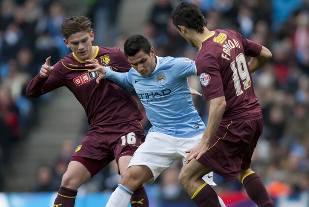 Manchester City's Marcos Lopes, centre, fights for the ball against Watford's Sean Murray, left, and Marco Davide Faraoni during their English FA Cup fourth round soccer match at The City of Manchester Stadium, Manchester, England, Saturday, Jan. 25, 2014. (AP Photo/Jon Super)