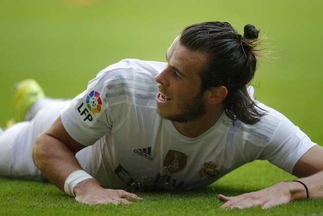 Real Madrid's Gareth Bale reacts during a Spanish La Liga soccer match between Real Madrid and Sporting de Gijon at the 'El Molinon' stadium in Gijon, Spain, Sunday, Aug. 23, 2015. (AP Photo/Jose Vicente)