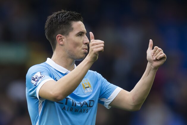 Manchester City's Samir Nasri gives a thumbs up signal to supporters after his team's 2-0 win during the English Premier League soccer match between Everton and Manchester City at Goodison Park Stadium, Liverpool, England, Sunday Aug. 23, 2015. (AP Photo/Jon Super)