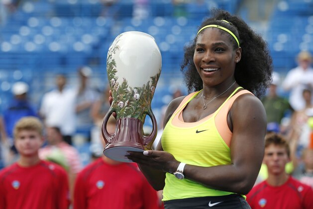 Aug 23, 2015; Cincinnati, OH, USA; Serena Williams (USA) holds the Rookwood Cup after defeating Simona Halep (not pictured) in the finals during the Western and Southern Open tennis tournament at the Linder Family Tennis Center. Mandatory Credit: Aaron Doster-USA TODAY Sports
