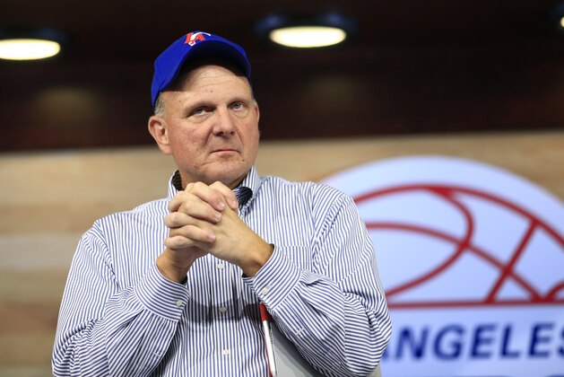 New Los Angeles Clippers owner Steve Ballmer pauses for a moment after speaking at the Clippers Fan Festival on Monday, Aug. 18, 2014, in LA. (AP Photo/Jae C. Hong)