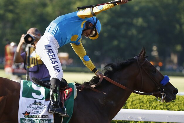 Victor Espinoza reacts after guiding American Pharoah across the finish line to win the 147th running of the Belmont Stakes horse race at Belmont Park, Saturday, June 6, 2015, in Elmont, N.Y. American Pharoah is the first horse to win the Triple Crown since Affirmed won it in 1978. (AP Photo/Kathy Willens)