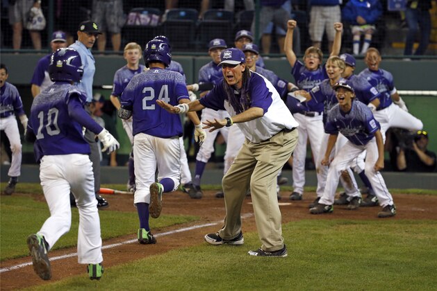 Pearland, Texas' Caleb Low (10) heads for home and a walk-off celebration after hitting a two-run home run off Bonita, Calif.'s Jacob Baptista during the eighth inning of an United States elimination baseball game at the Little League World Series tournament in South Williamsport, Pa., Thursday, Aug. 27, 2015. Pearland, Texas won 9-7. (AP Photo/Gene J. Puskar)