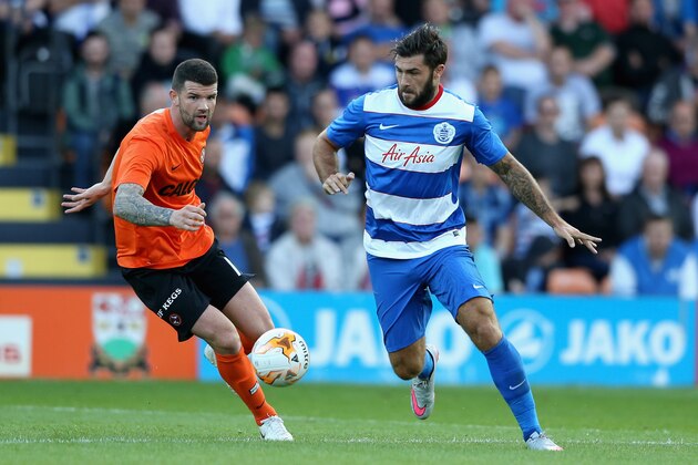 BARNET, ENGLAND - JULY 22:  Charlie Austin of Queens Park Rangers moves away from Mark Durnan during the pre season friendly match between Queens Park Rangers and Dundee United at The Hive on July 22, 2015 in Barnet, England.  (Photo by David Rogers/Getty Images)