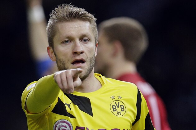 Dortmund's Jakub Blaszczykowski from Poland points during the German Bundesliga soccer match between Hertha BSC Berlin and Borussia Dortmund at the Olympia stadium in Berlin, Germany, Saturday, Dec. 13, 2014. Berlin defeated Dortmund by 1-0.(AP Photo/Michael Sohn)