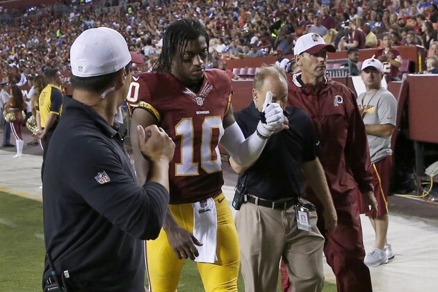 Washington Redskins quarterback Robert Griffin III (10) leaves the field after an injury during the first half of an NFL preseason football game against the Detroit Lions, Thursday, Aug. 20, 2015, in Landover, Md. (AP Photo/Alex Brandon)