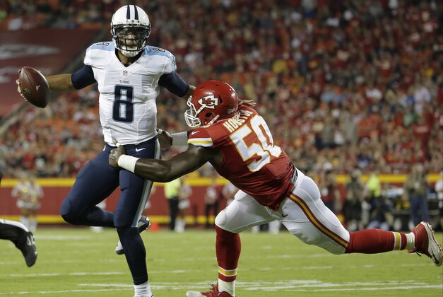 Tennessee Titans quarterback Marcus Mariota (8) is tackled by Kansas City Chiefs linebacker Justin Houston (50) during the first half of a preseason NFL football game at Arrowhead Stadium in Kansas City, Mo., Friday, Aug. 28, 2015. (AP Photo/Charlie Riedel)
